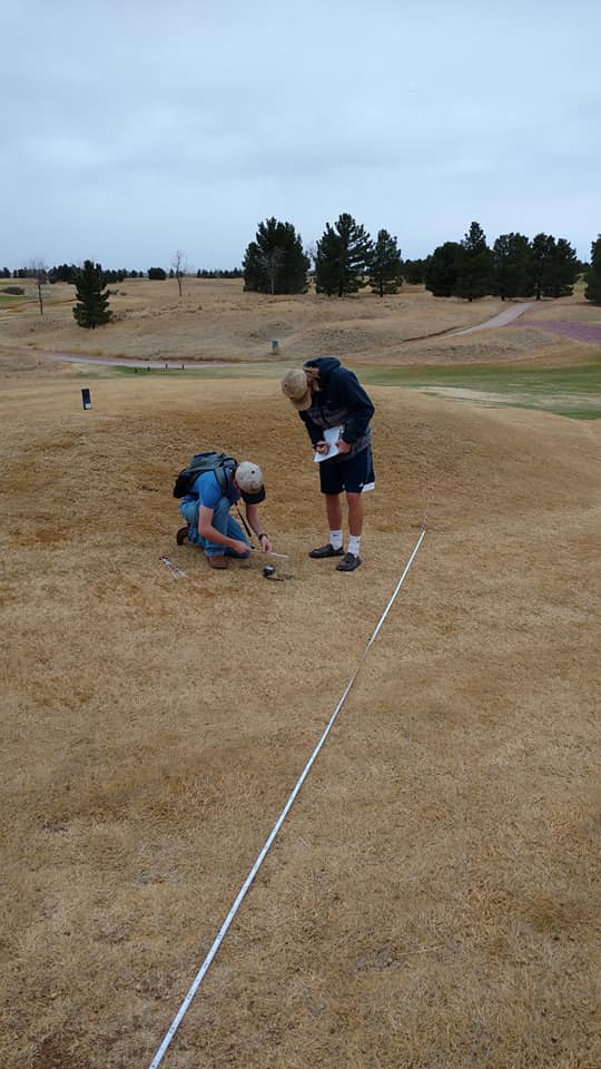 Connor Steel and Jacob Doskocil measuring vegetation