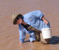 Dr Griffis-Kyle playing in cattle tanks on the Jornada LTER